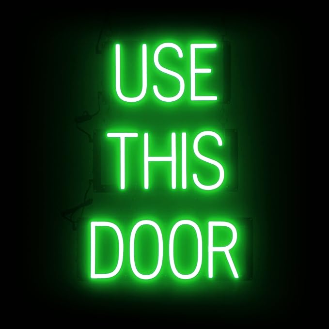 SpellBrite USE THIS DOOR Sign | Directional Sign with Neon Look, Green LED Light Source | 17.4" x 23.8"