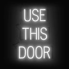 SpellBrite USE THIS DOOR Sign | Directional Sign with Neon Look, White LED Light Source | 17.4" x 23.8"