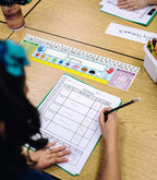 Carson Dellosa Education 30PC Quick Stick Name Plate Set offers alphabet charts, number lines, a 100 chart, a ruler, and clear labels that support organized desks and help students develop skills well